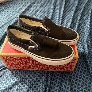 Black and white slip on vans